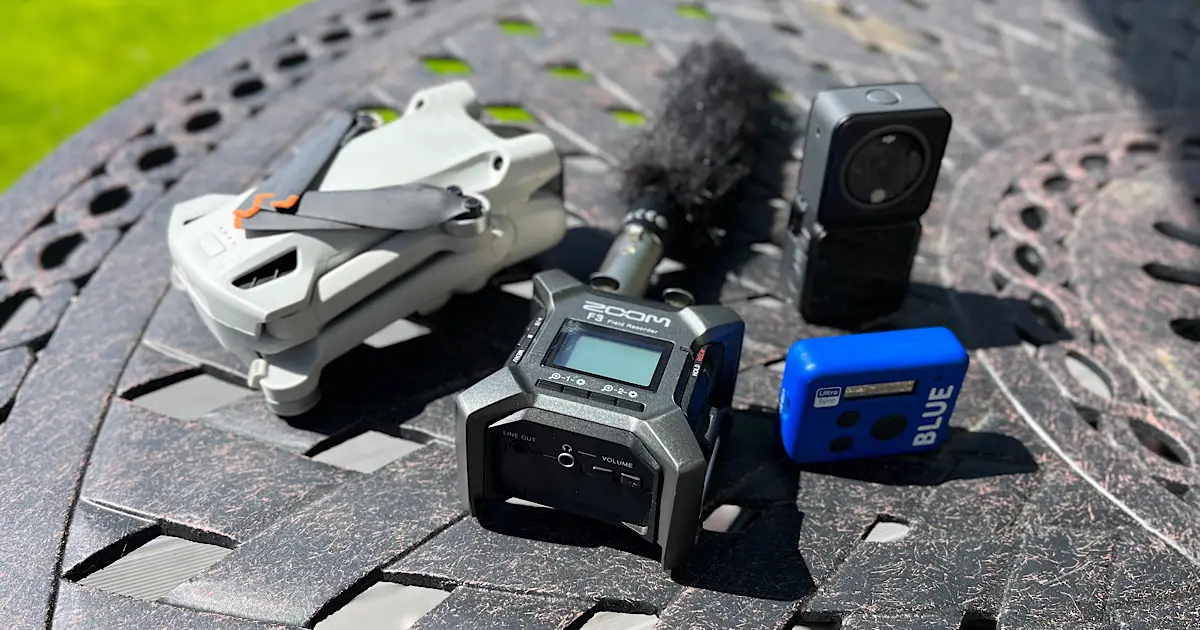 A table with a bunch of video and audio devices